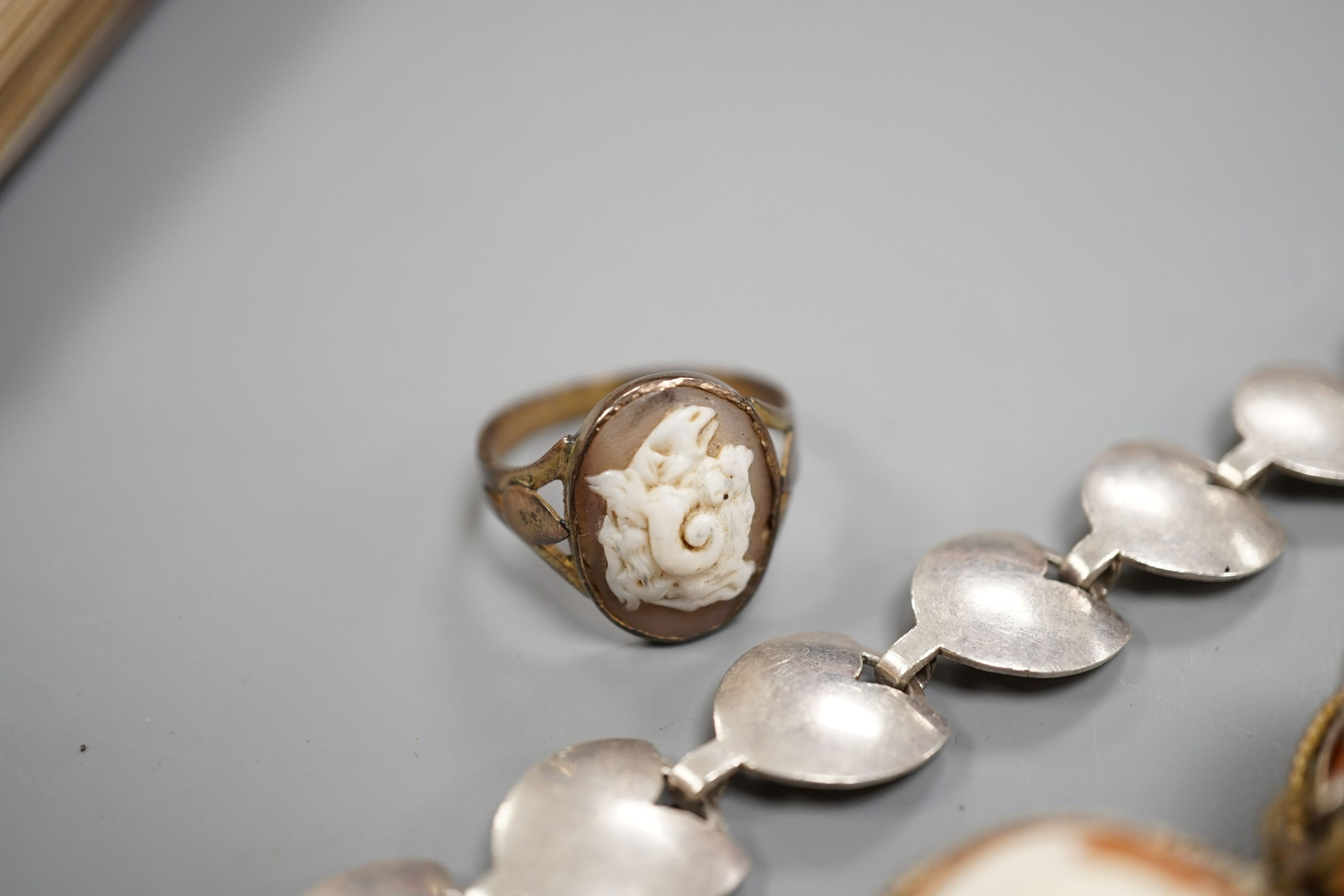 A gilt white metal and cameo shell set bracelet, a similar ring and a sterling 925 bracelet.